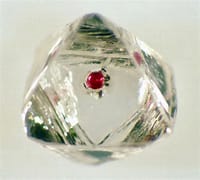 Diamond with garnet inclusion